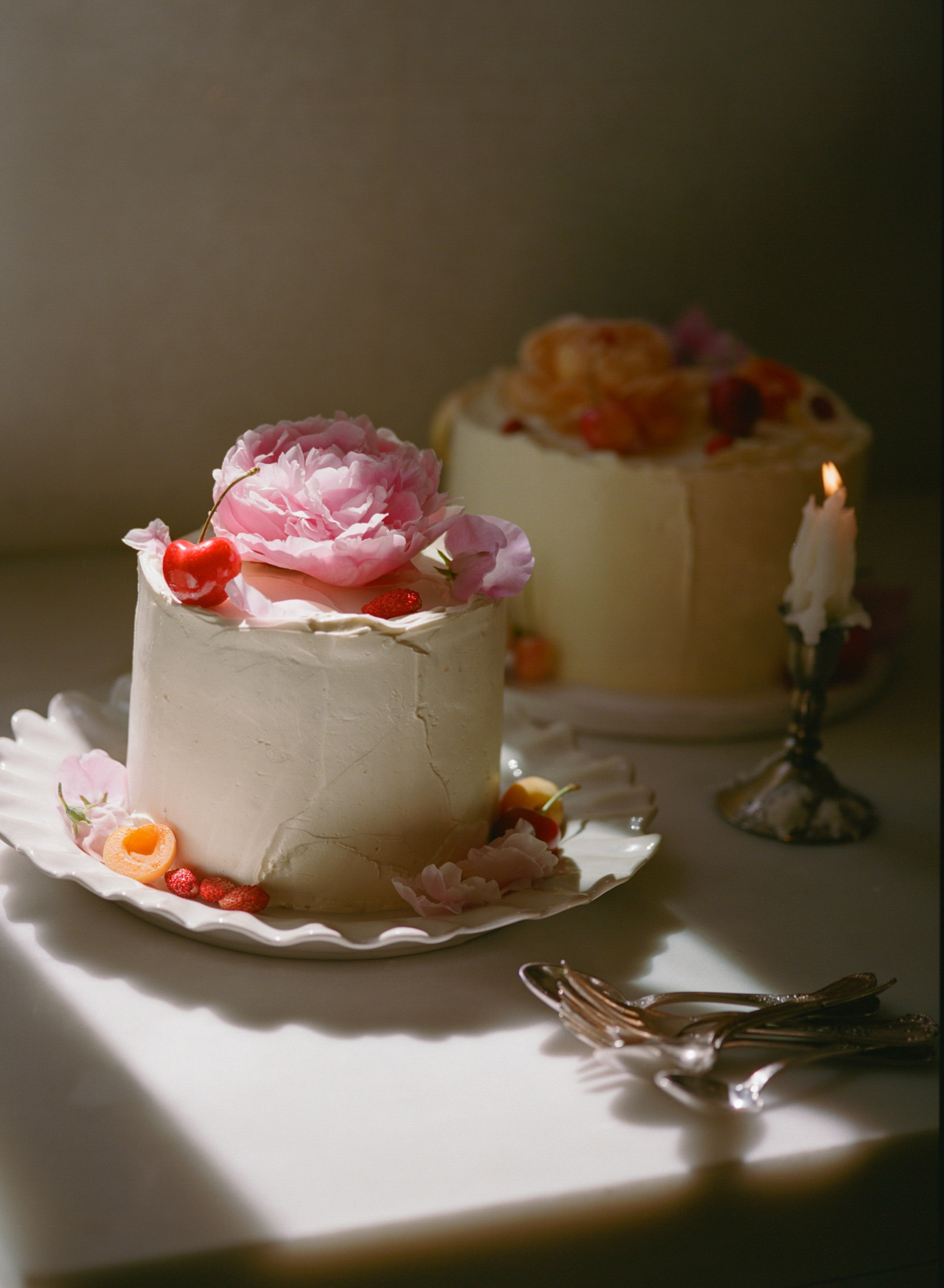Corn Chiffon with Lemon Verbena Custard, Roasted Plums & Olive Oil Swiss Buttercream